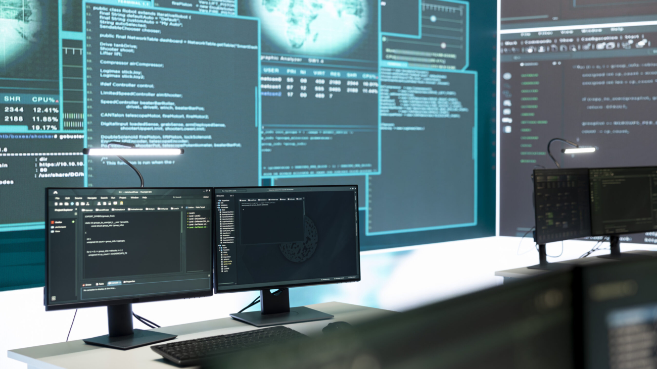 Cyber security monitoring room with high tech equipment. Governmental focus on cyber operations, cyber surveillance, and digital threats protection in an empty command workspace.