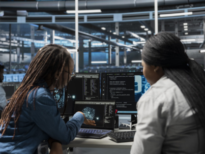 Data center admins using AI visualization tools to setup machine learning systems handling information. Experts using data analytics graphs to train neural networks to improve server farm operations