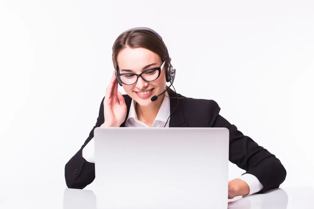 smiling-young-customer-service-girl-with-headset-her-workplace-isolated-white